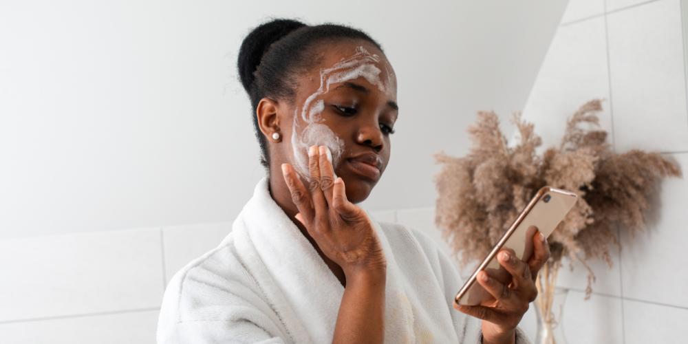 woman with face cream on face