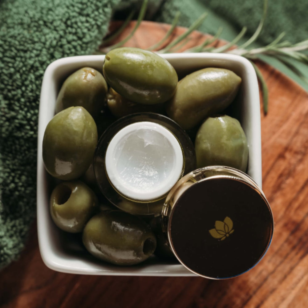 Face Treatment sitting in bowl of olives